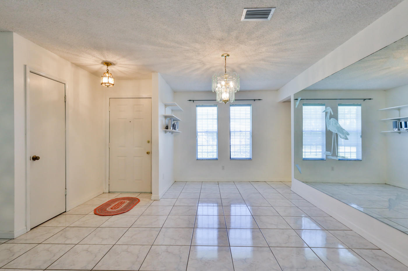 2629 Mango Tree Drive Edgewater, FL 32141 - Photo 3 of 30 a view of a room with window and chandelier fan