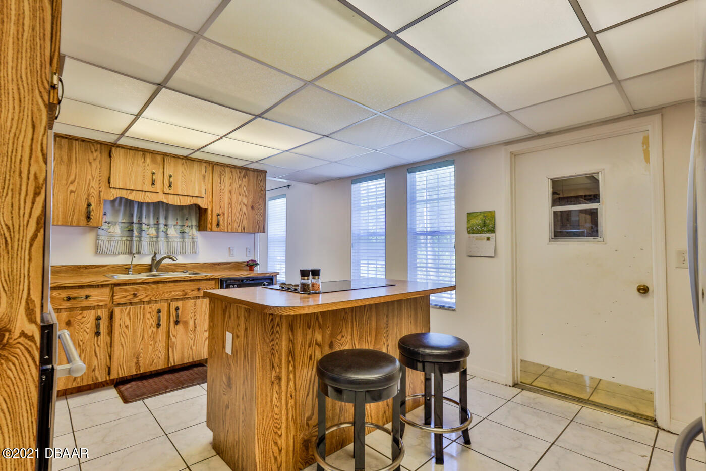 2629 Mango Tree Drive Edgewater, FL 32141 - Photo 9 of 30 a kitchen with stainless steel appliances granite countertop a sink and cabinets