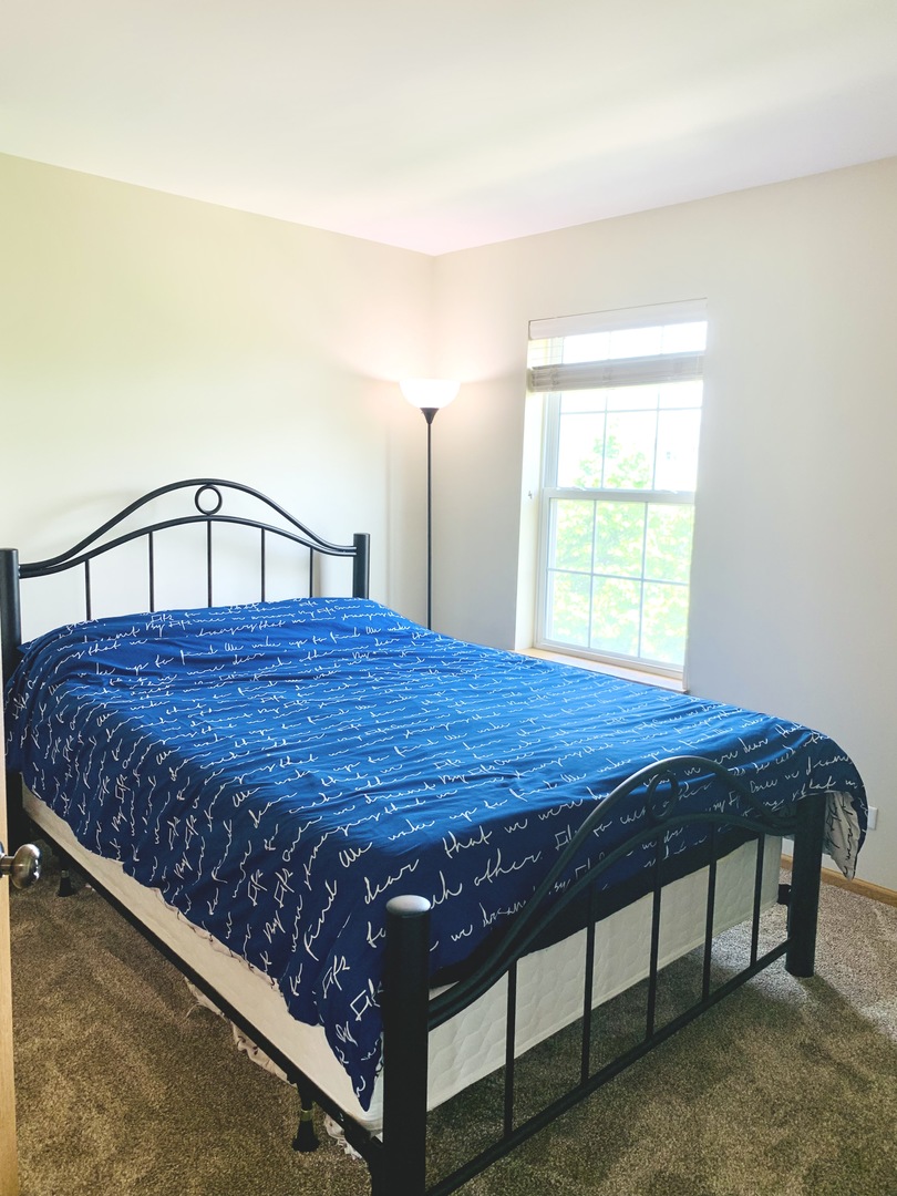 146 Goldenhill Street Carol Stream, IL 60188 - Photo 12 of 18 a bed sitting in a bedroom next to a window