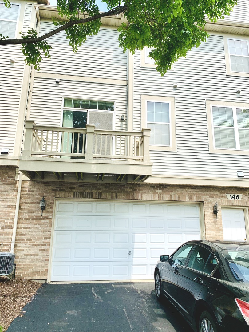 146 Goldenhill Street Carol Stream, IL 60188 - Photo 18 of 18 a front view of a house with parking