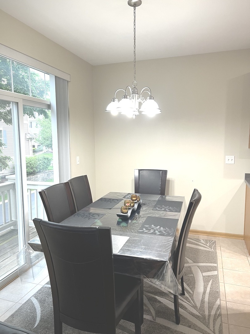 146 Goldenhill Street Carol Stream, IL 60188 - Photo 7 of 18 a view of a dining room with furniture window and outside view