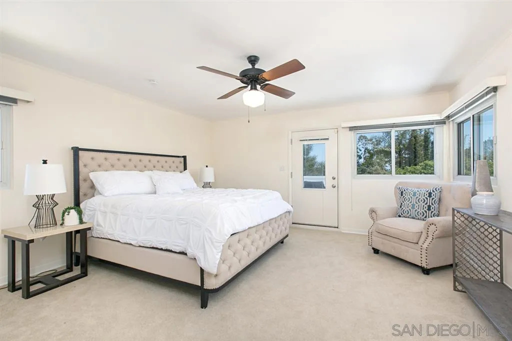 2355 Willow Street San Diego, CA 92106 - Photo 14 of 25 a bedroom with a bed couch and window