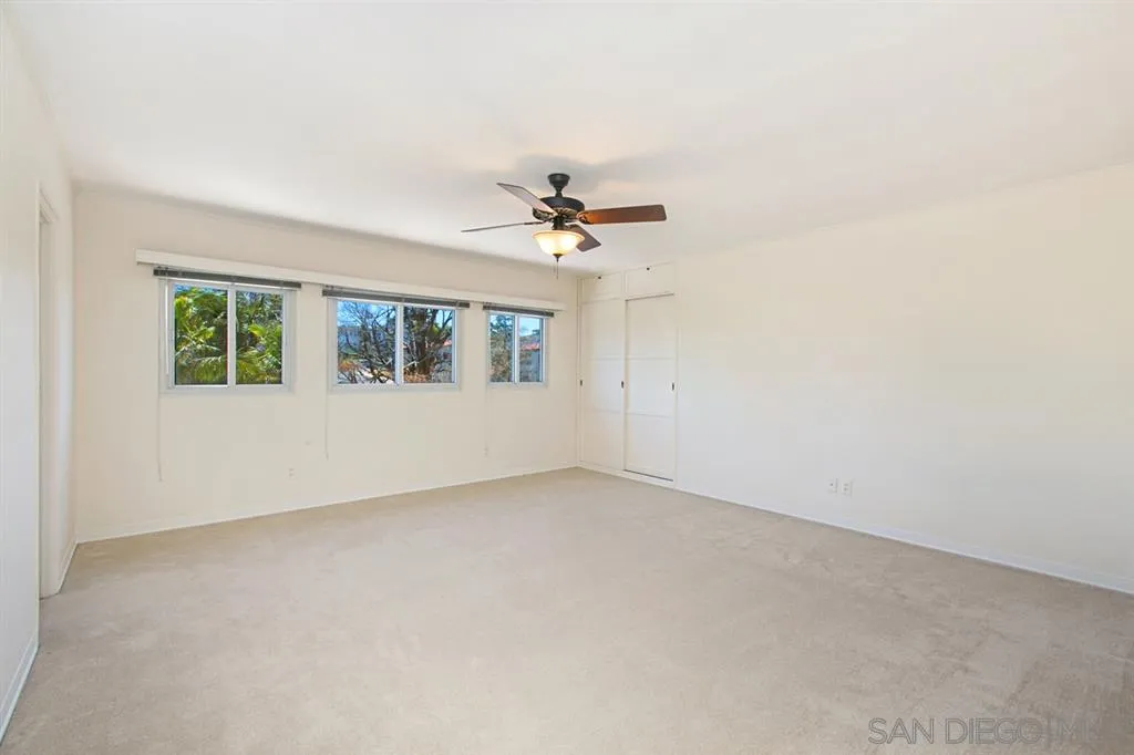 2355 Willow Street San Diego, CA 92106 - Photo 15 of 25 an empty room with a window and a ceiling fan