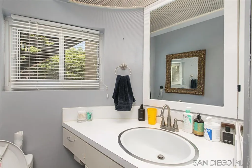 2355 Willow Street San Diego, CA 92106 - Photo 20 of 25 a bathroom with a sink and a mirror