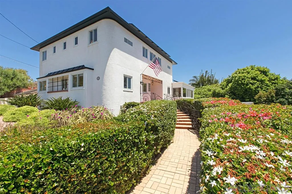 2355 Willow Street San Diego, CA 92106 - Photo 3 of 25 a front view of a house with a yard