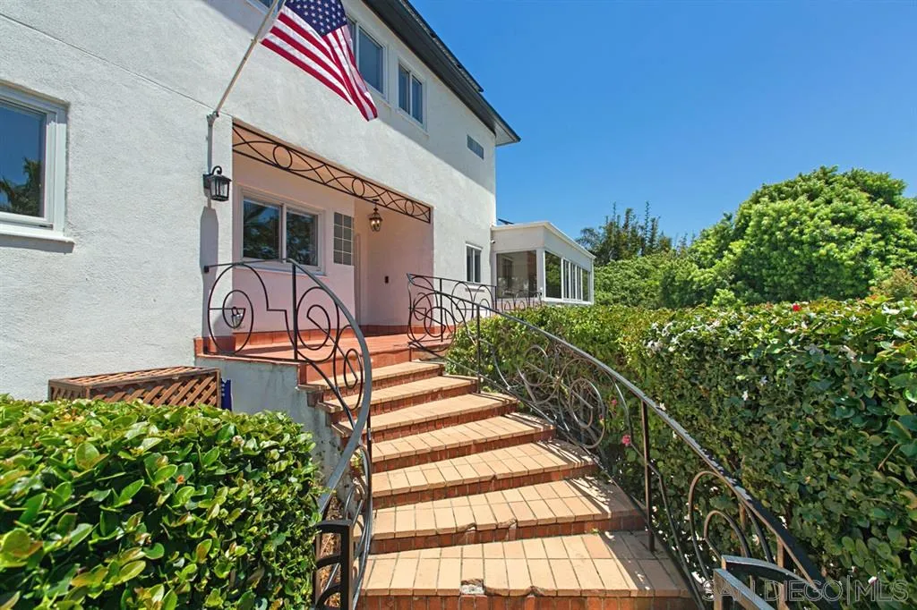 2355 Willow Street San Diego, CA 92106 - Photo 4 of 25 a front view of a house with a yard