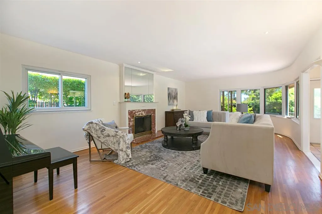 2355 Willow Street San Diego, CA 92106 - Photo 5 of 25 a living room with fireplace furniture and a wooden floor