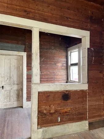 a view of front door of house with wooden door