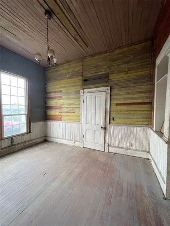 a view of a livingroom with wooden floor