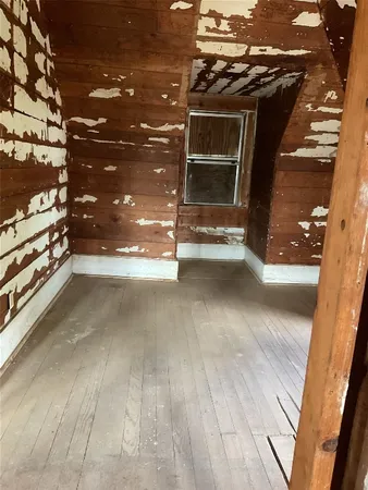 a view of room with stairs and a window