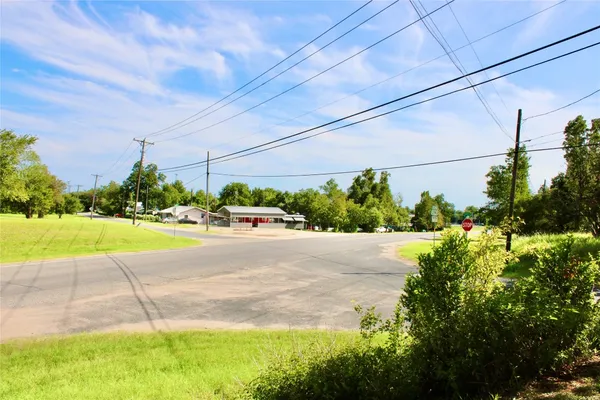 a view of street with houses and trees