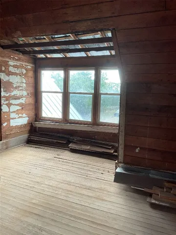 a bathroom with a vanity and a large window