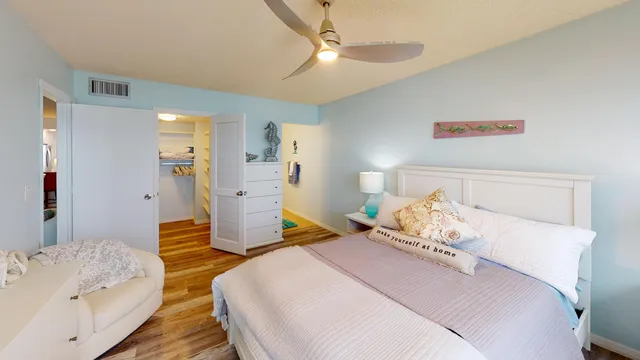 a bedroom with two beds and painted walls