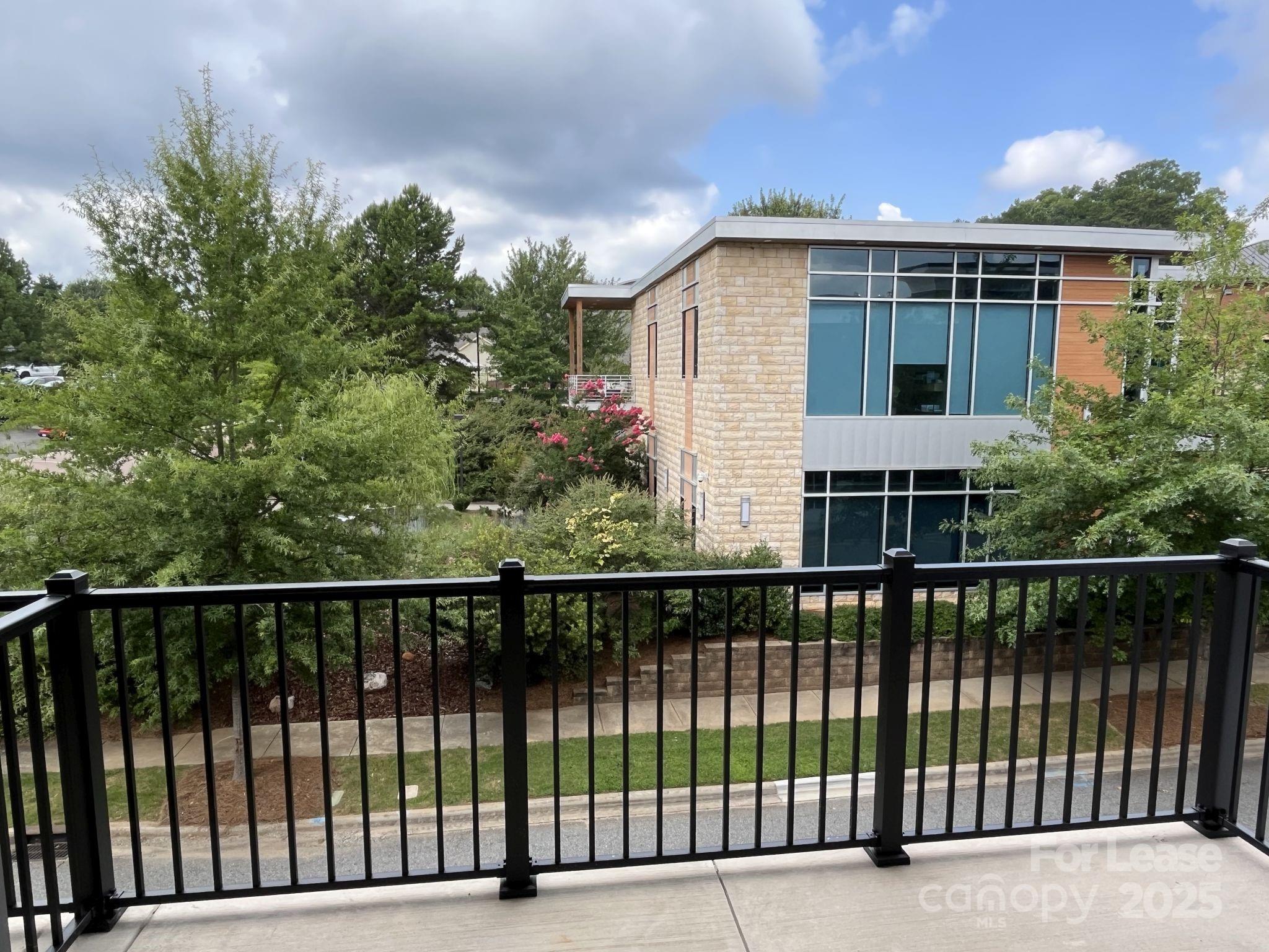 19546 Greentree Way, Unit 203 Cornelius, NC 28031 - Photo 20 of 32 a view of a house with a balcony