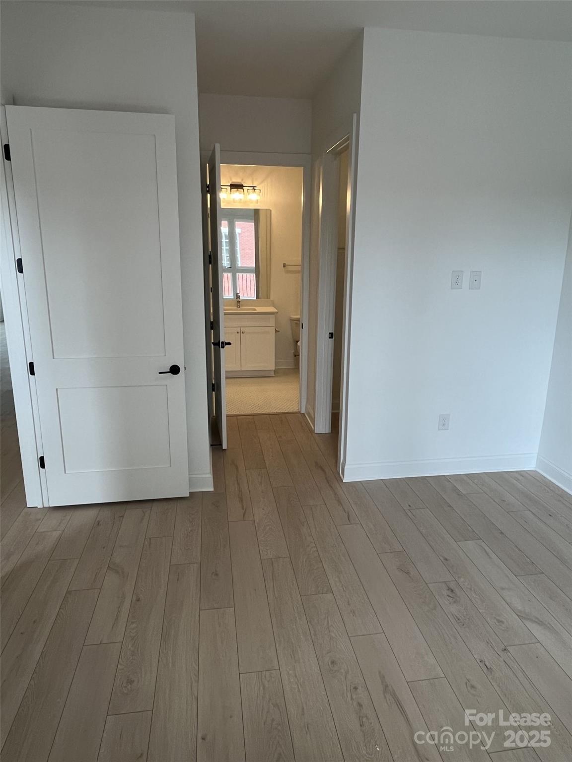 19546 Greentree Way, Unit 203 Cornelius, NC 28031 - Photo 27 of 32 a view of wooden floor in an empty room