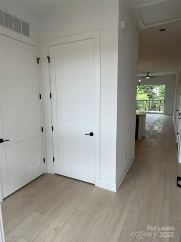 a kitchen with a sink a refrigerator and cabinets