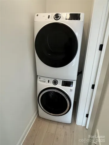 a kitchen with granite countertop a refrigerator and a stove top oven
