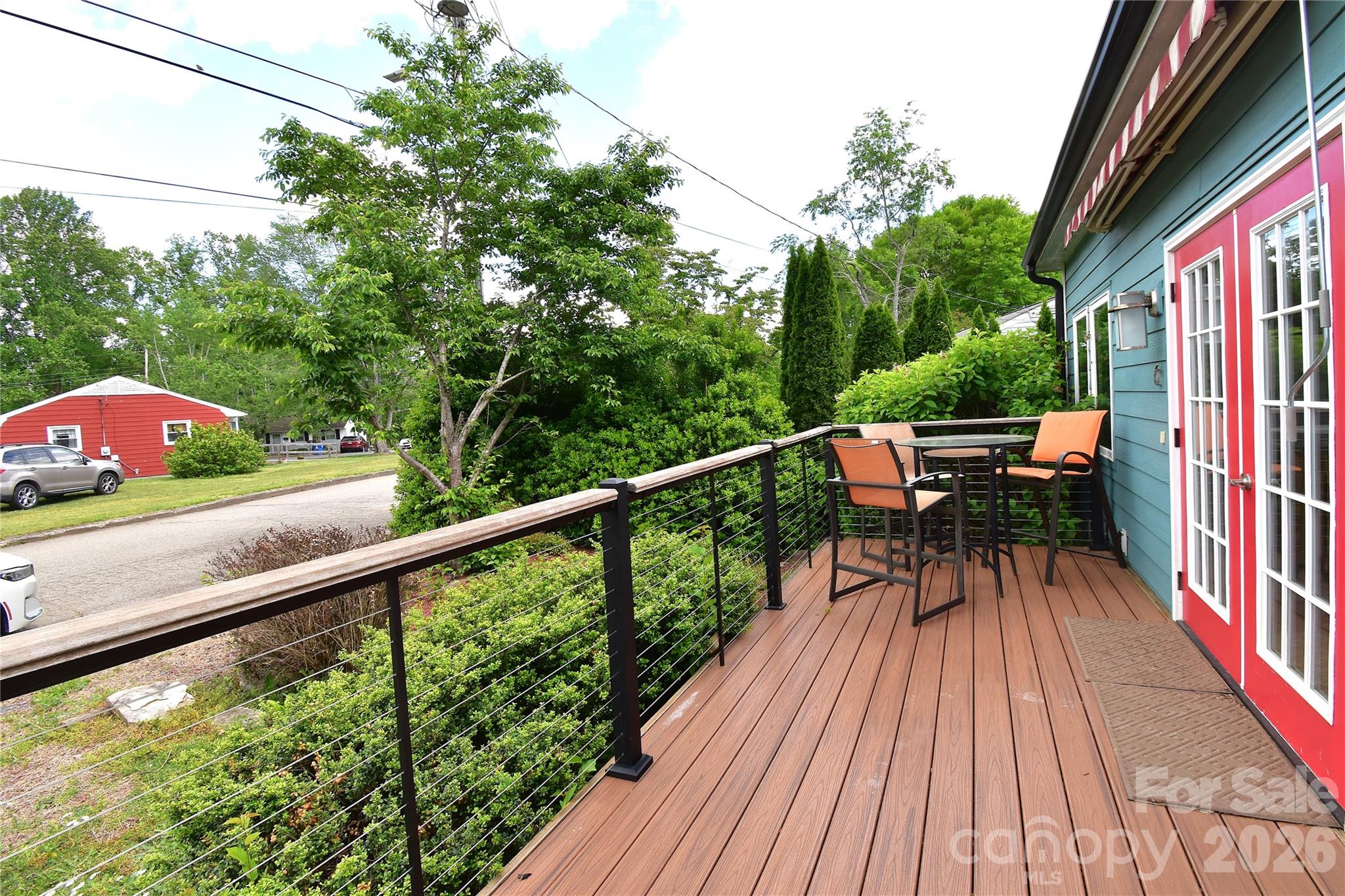 6 Belvedere Road Asheville, NC 28803 - Photo 21 of 33 a view of balcony with furniture and wooden floor