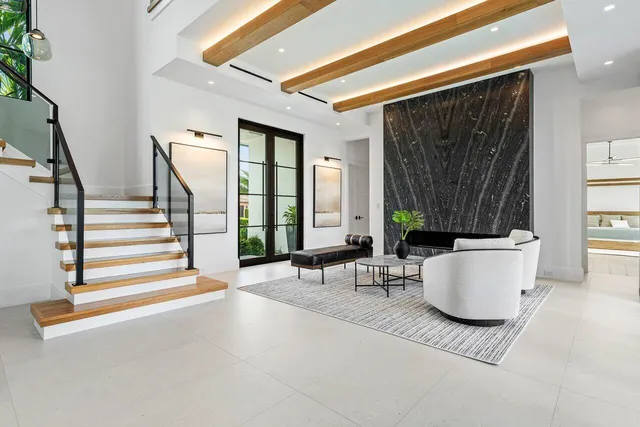 a large kitchen with a table and chairs