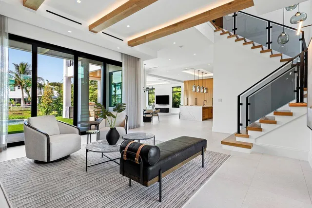 a living room with stainless steel appliances kitchen island granite countertop furniture and a view of kitchen