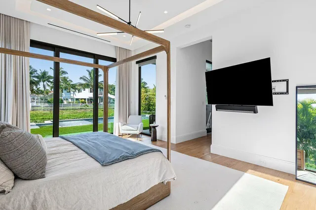 a view of a lake with a house swimming pool and outdoor space