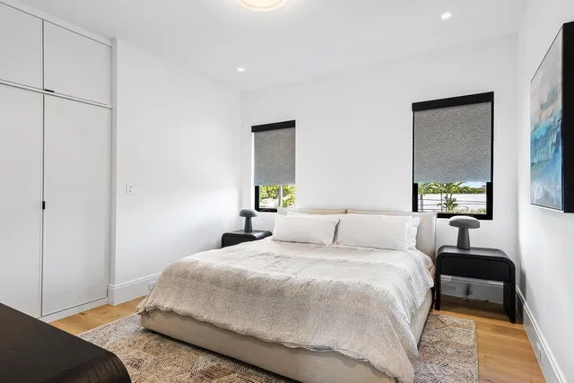 an aerial view of residential houses with outdoor space and swimming pool