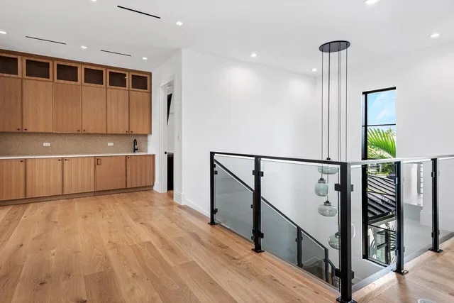 an aerial view of a house with swimming pool and garden