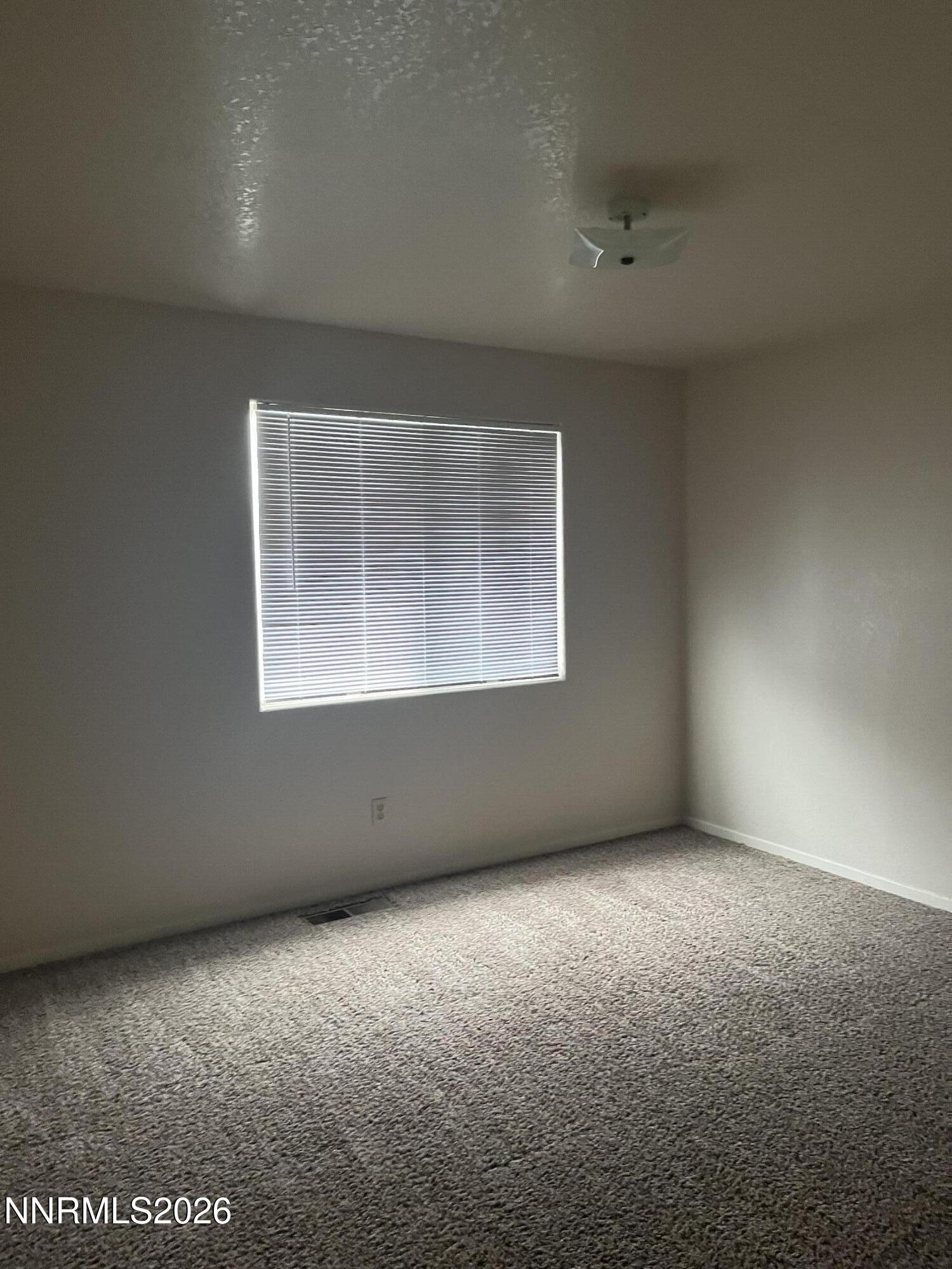 3300 White Lake Parkway Reno, NV 89508 - Photo 14 of 17 an empty room with a window