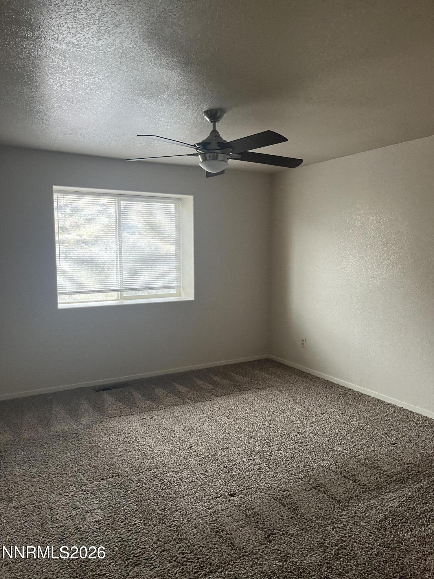 3300 White Lake Parkway Reno, NV 89508 - Photo 15 of 17 an empty room with a window