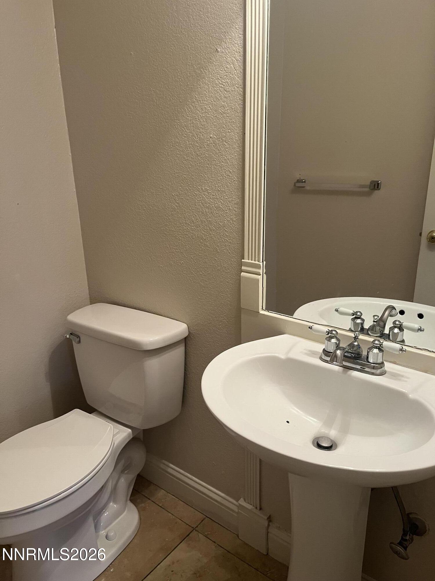 3300 White Lake Parkway Reno, NV 89508 - Photo 5 of 17 a white toilet sitting next to a bathroom sink