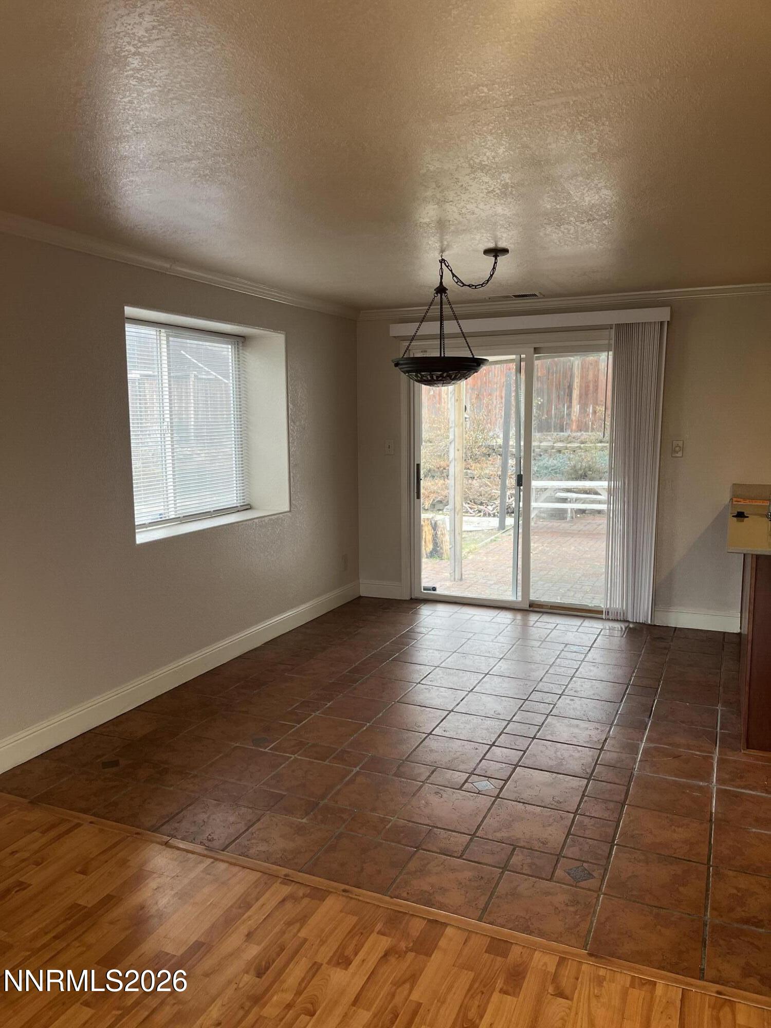 3300 White Lake Parkway Reno, NV 89508 - Photo 7 of 17 an empty room with wooden floor and windows