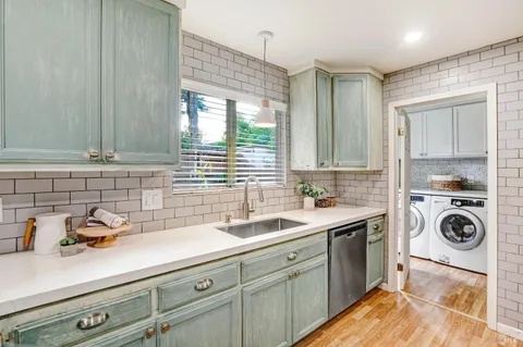 a kitchen with a sink and cabinets