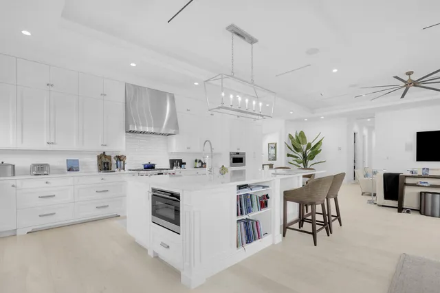 a kitchen with cabinets a sink and appliances