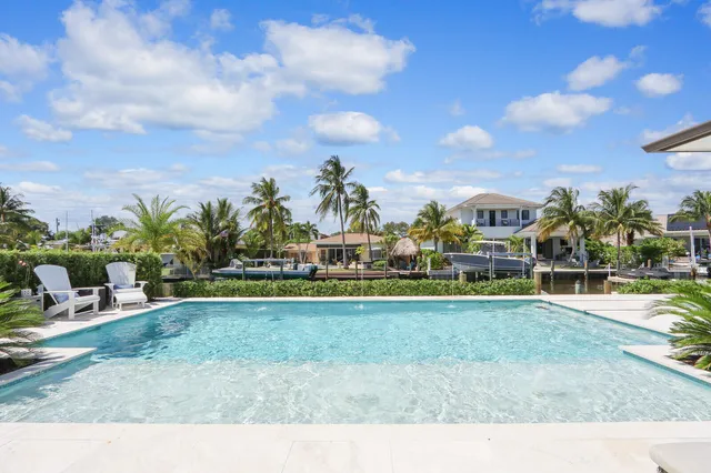 a view of swimming pool from a garden