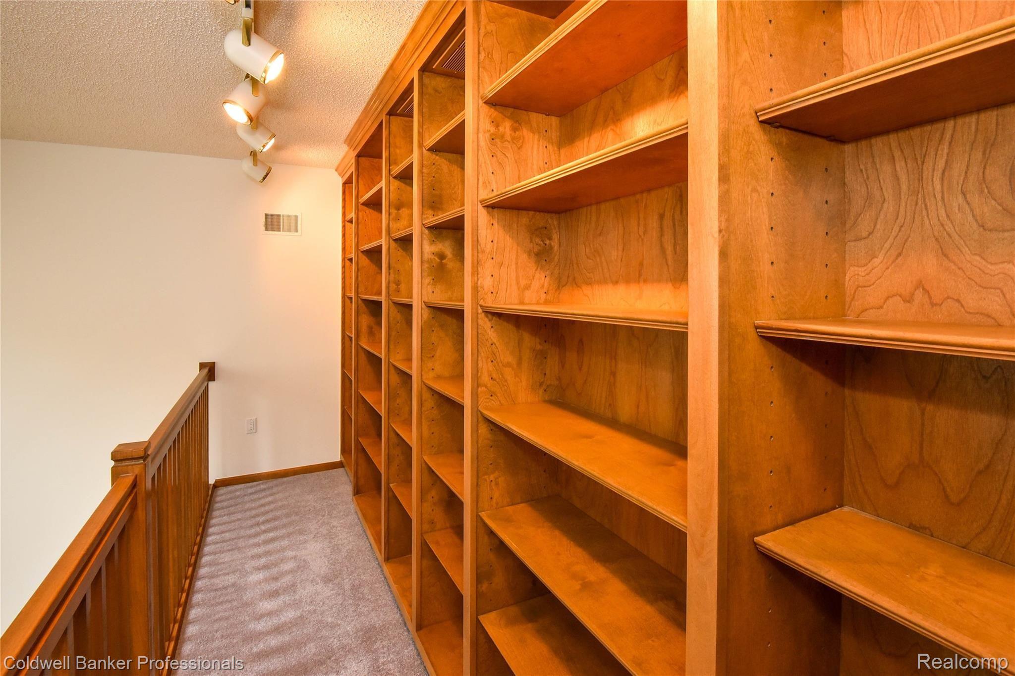 9275 Fox Hollow Road Clarkston, MI 48348 - Photo 36 of 68 Custom Shelving in Loft Area