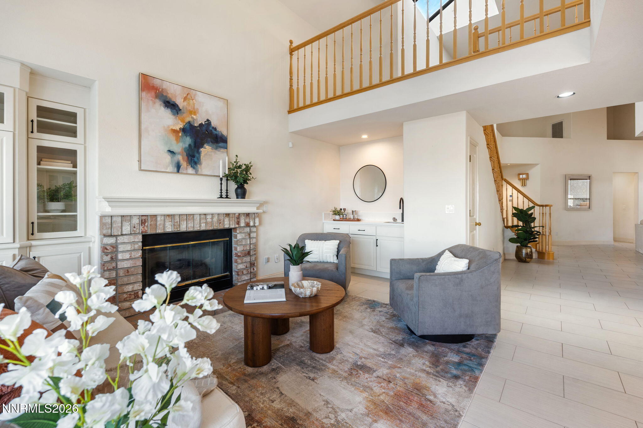 6186 Squires Lane Reno, NV 89519 - Photo 21 of 57 a living room with furniture and a fireplace
