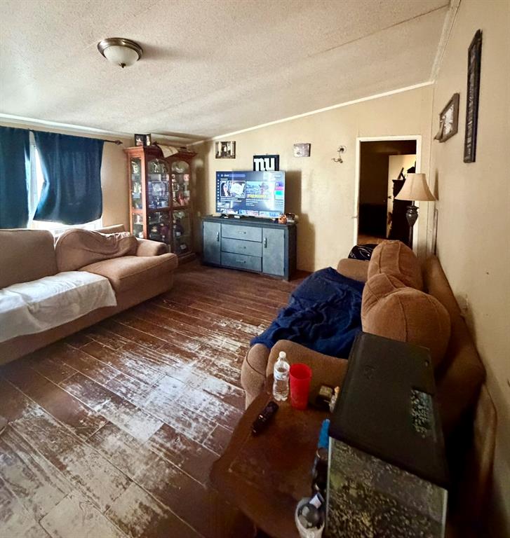 721 Richardson Road Stonewall, LA 71078 - Photo 2 of 11 a living room with furniture and a flat screen tv
