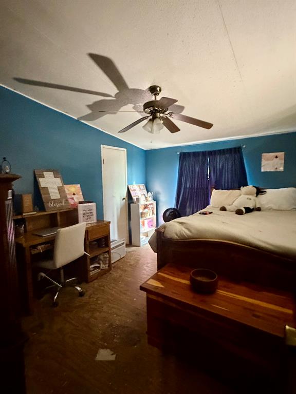 721 Richardson Road Stonewall, LA 71078 - Photo 6 of 11 a bedroom with a bed and a chandelier