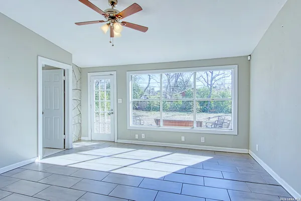 a large kitchen with stainless steel appliances lots of counter space and a sink