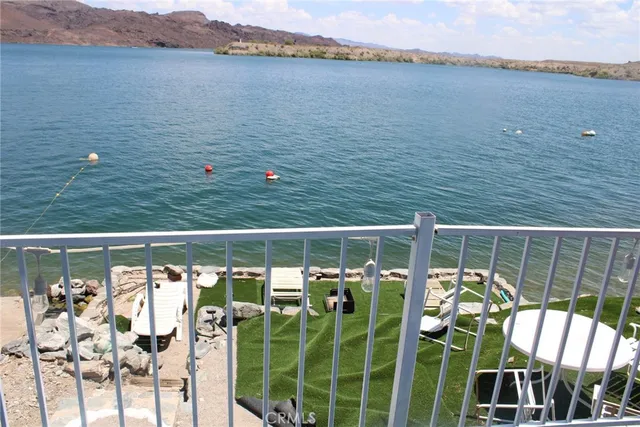 a view of a balcony with lake view and mountain view