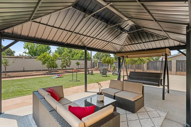 a view of yard with patio