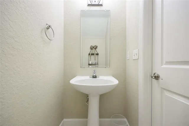 a bathroom with a sink toilet