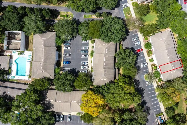an aerial view of a house with a yard and garden