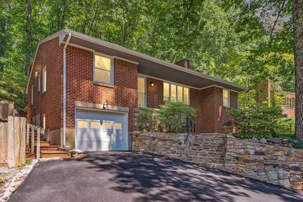 a front view of a house with yard