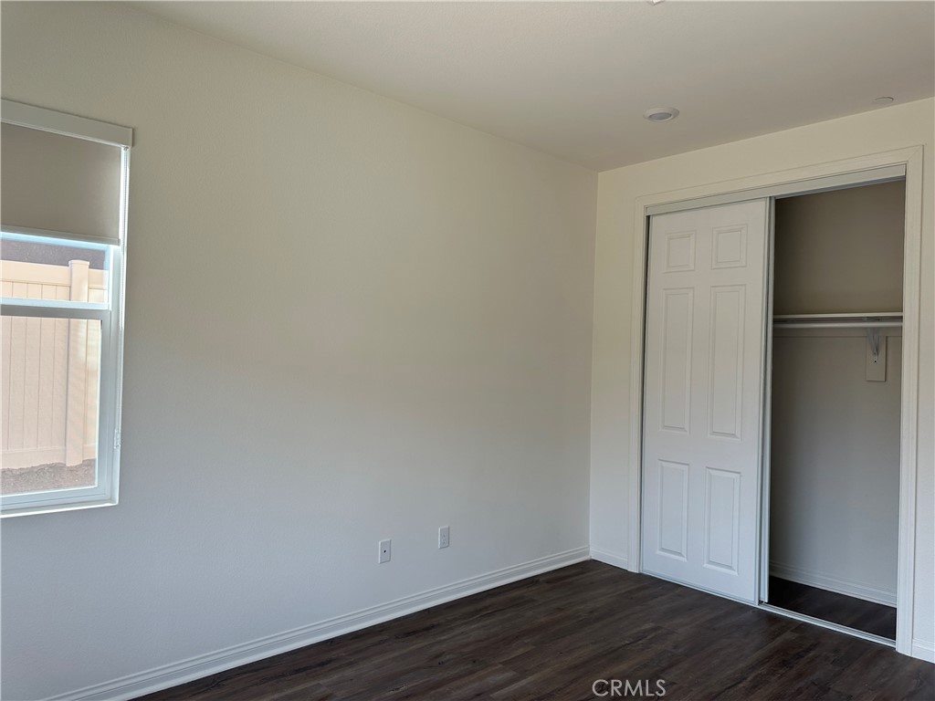 7560 Citrusmoon Court Riverside, CA 92507 - Photo 11 of 18 a view of small space with wooden floor