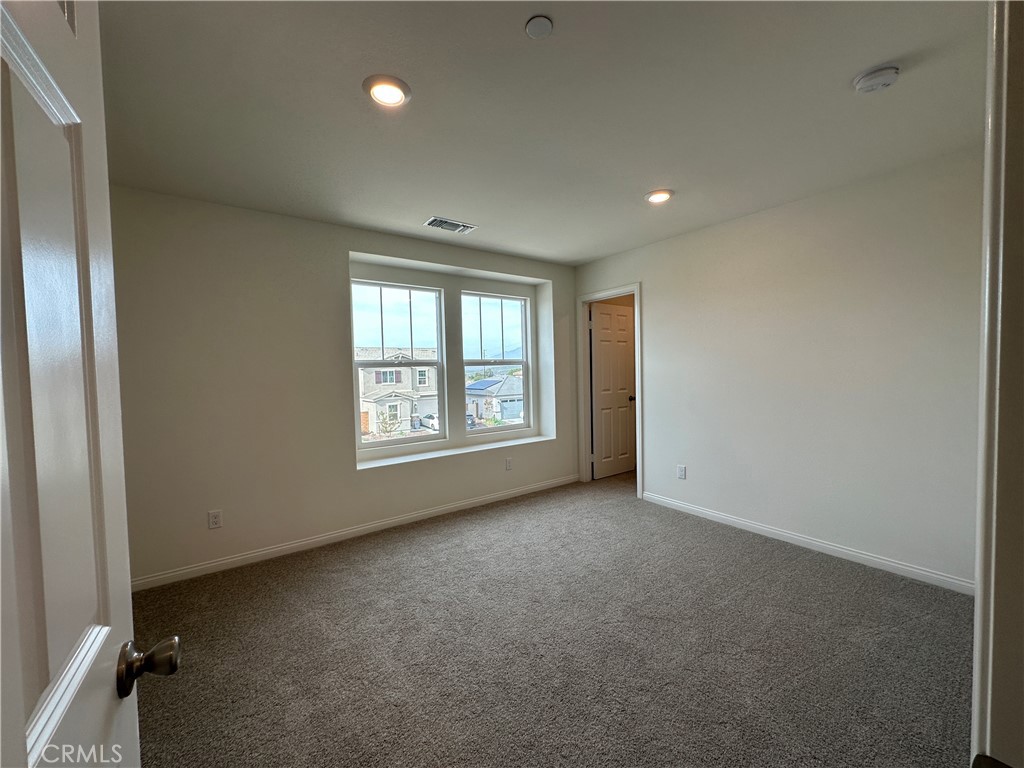 7560 Citrusmoon Court Riverside, CA 92507 - Photo 13 of 18 an empty room with windows
