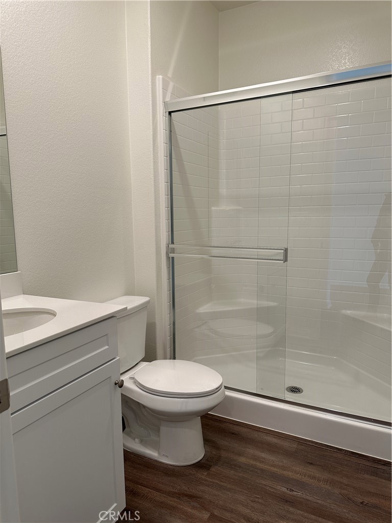 7560 Citrusmoon Court Riverside, CA 92507 - Photo 16 of 18 a bathroom with a toilet and a shower