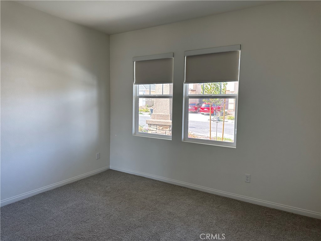 7560 Citrusmoon Court Riverside, CA 92507 - Photo 8 of 18 an empty room with a window
