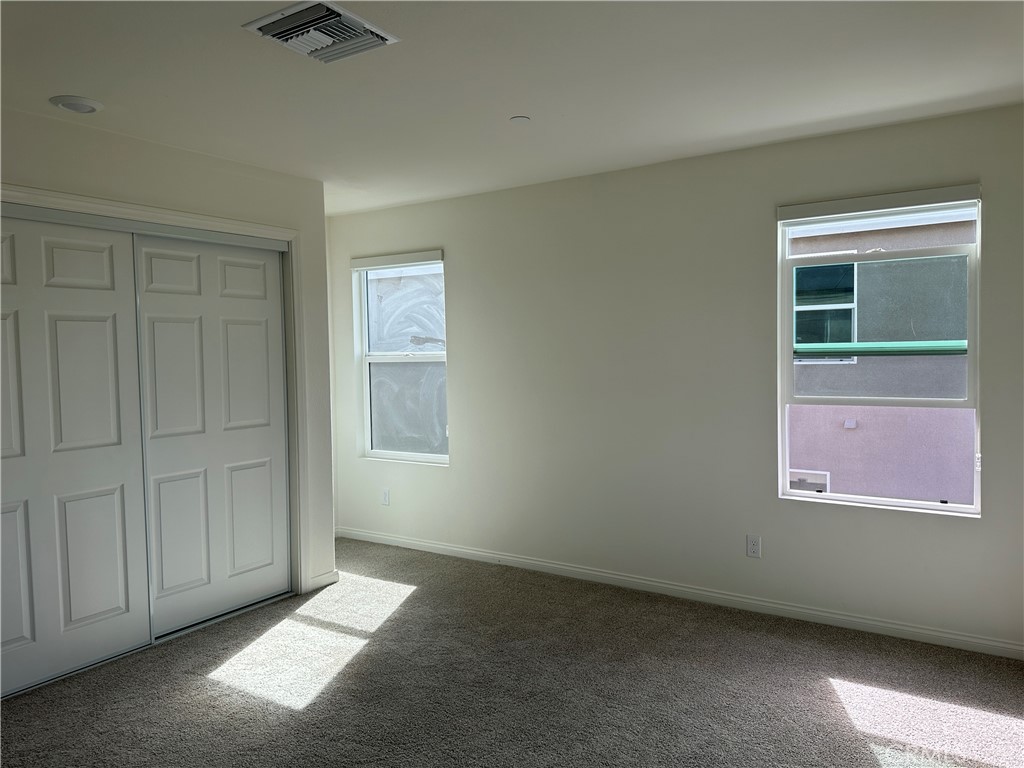 7560 Citrusmoon Court Riverside, CA 92507 - Photo 9 of 18 an empty room with windows