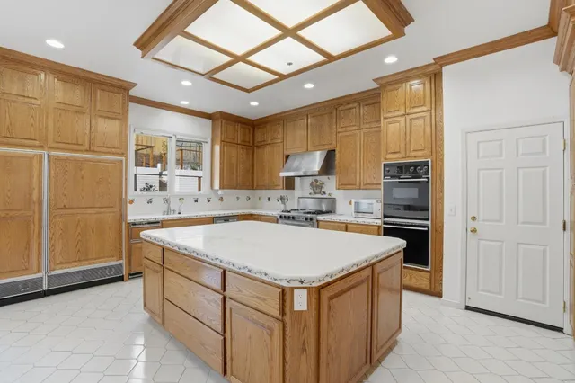 a front view of a house with a yard table and chairs
